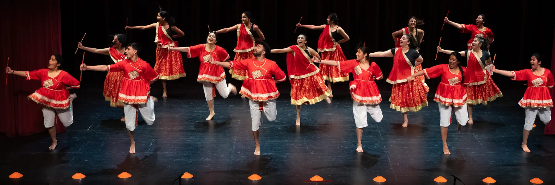 A group of dancers performing on stage during AsianFest.